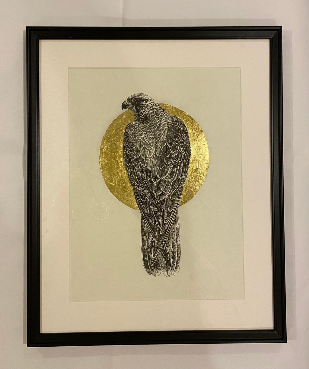 Falcon with gold